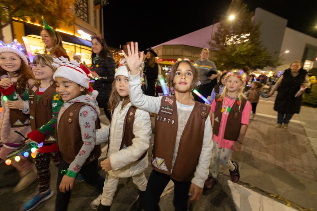 Beyond Shopping: The Rise of Experiential Retail in Shopping Centers Girl Scouts parade bringing families together during an experiential retail event.