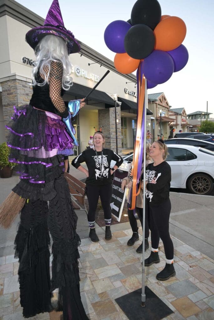 Has Halloween Replaced Thanksgiving as The New Fall Favorite Holiday? Halloween marketing street event with costumed performer and decorations