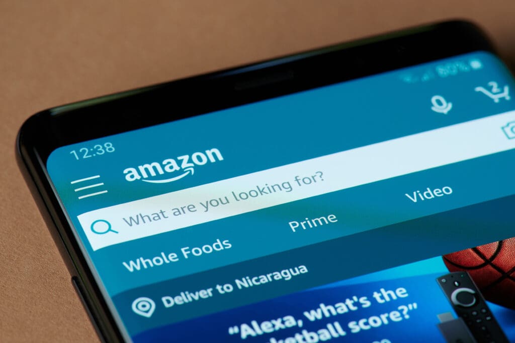 Why Retail Isn’t the Same as 15 Years Ago: The Amazon Effect on Retail Smartphone screen showing the Amazon app search bar illustrating the Amazon effect on retail and e-commerce growth.
