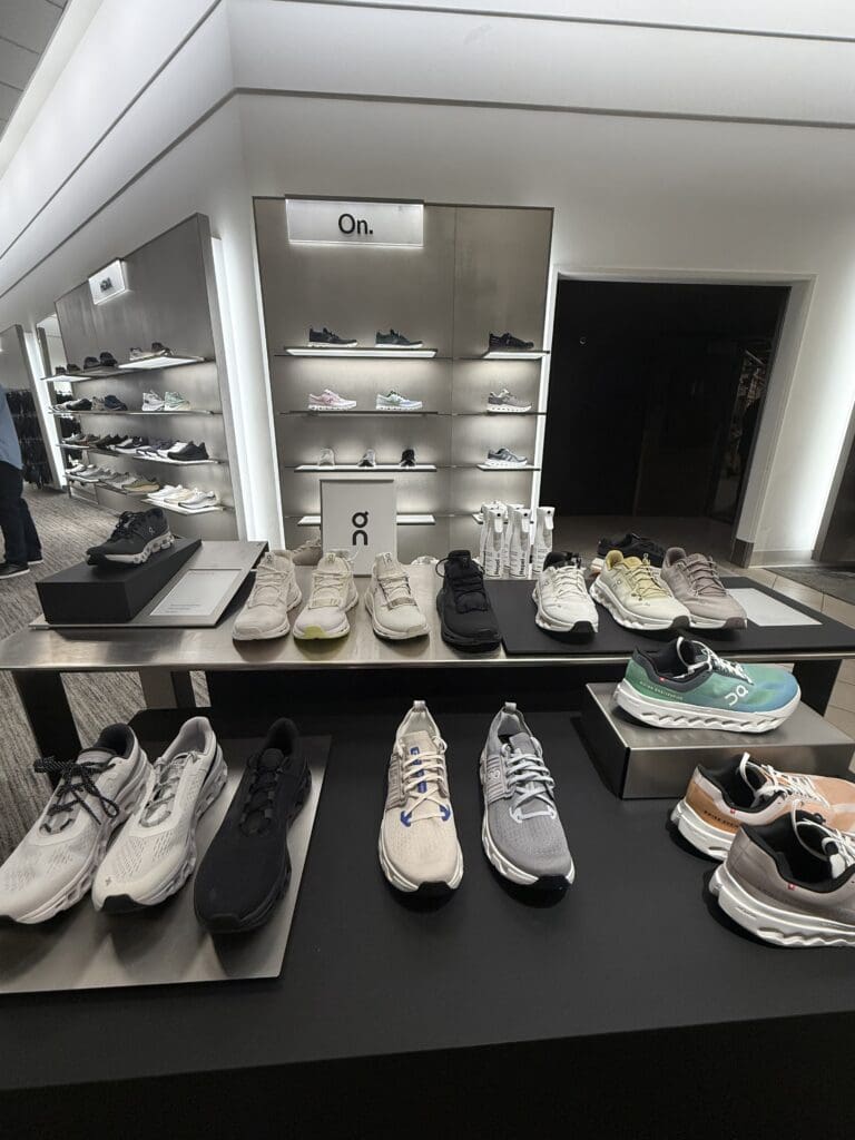 How to Add Meaning (and Magic) to Holiday Retail Marketing in 2025 Display of On sneakers inside Nordstrom store, representing product selection and inventory strategy in holiday retail marketing.