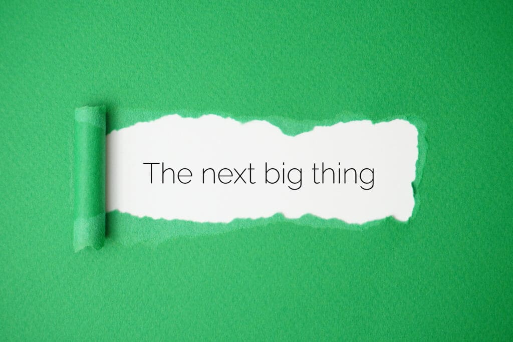 AI Powered Search: We Discover What’s Next AI powered search concept showing the phrase the next big thing revealed through torn green paper