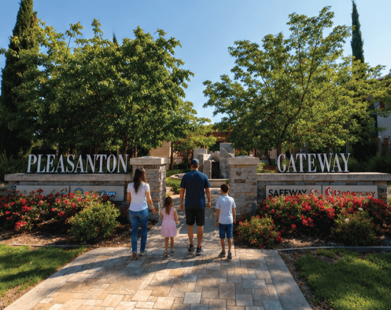 Market Research Photo of a family at the entrance to the Pleasanton Gateway shopping center on a sunny day